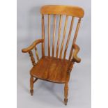 A 19thC lathe back open armchair, with a solid seat on turned legs with 'H' stretcher.