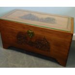 A 20thC carved Oriental camphorwood chest, with glass top, 88cm wide.