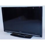 A Sharp 40" black LCD television.