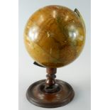 A 19thC New Terrestrial Globe, published by H Collins of London, on a turned mahogany stand and