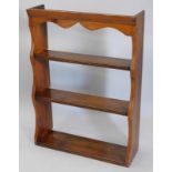 A 19thC pitch pine plate rack, with shaped sides, 69cm wide.