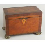 A George III mahogany inlaid and amboyna tea caddy, of rectangular outline, the hinged lid revealing