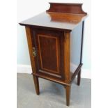 An Edwardian and mahogany satinwood crossbanded pot cupboard, with a single panelled door on