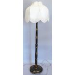 A black japanned standard lamp, with modern shade, 176cm high overall.