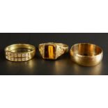 Three 9ct gold dress rings, to include a wedding band, a white stone set dress ring, and a stone set