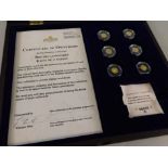 A set of six small gold coins, issued by the Windsor Mint, certificate number 956, British