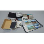 A large quantity of late 20thC postcards etc., (two boxes)