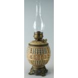 A late 19thC pottery oil lamp by Fischer of Budapest, decorated with Islamic style roundels in the