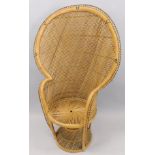 A Rattan peacock type chair, with a shaped back, circular seat etc.