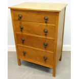 A small 20thC narrow oak chest, of four drawers with tear drop handles, 60cm wide.