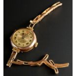 A 9ct gold wristwatch, with golden coloured circular dial, with black hands, 16.7g all in.