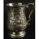 A Victorian silver tankard, embossed with flowers and scrolls, engraved 1st Lincoln Rifle Volunteers