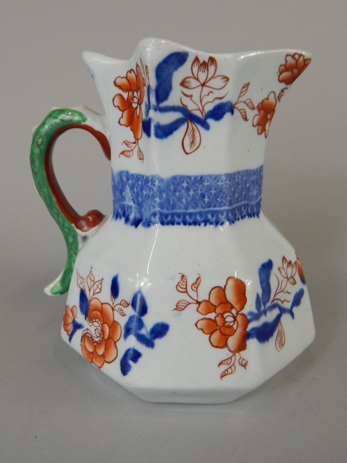 A Mason's Ironstone china octagonal jug, with Imari style decoration and dragon handle, 13cm high.