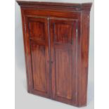 An early 19thC mahogany and ebony strung corner cabinet, with two panelled doors, 87cm wide (M)