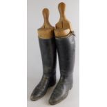 A pair of black leather gentleman's hunting boots, with trees. (AF)