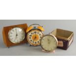 Three retro style clocks, to include a Westclock of Scotland, yellow and brown example.