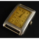 A silver watch head, with engraved panel to side, blue hands, and seconds dial and bezel wind, 22.7g