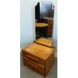 An Art Deco style G-Plan type small dressing table, with rectangular mirror, two drawers to the