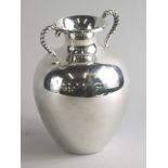 A vase, with ropework handles and bulbous body, white metal marked 925, 17cm high.