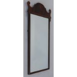 A mahogany fret frame wall mirror, with a rectangular plate, 77cm high, 38cm wide.