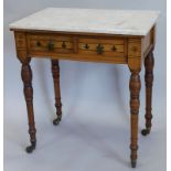 A small Victorian Arts and Crafts style walnut wash stand, with a white marble top above two