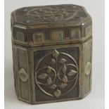 A late 19th/early 20thC Aesthetic pewter and oak tea caddy, with a castellated raised floral lid,