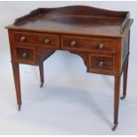 An Edwardian mahogany and satinwood crossbanded wash stand, with a raised back above two short and