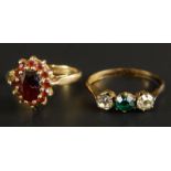 A 9ct gold dress ring and another, the dress ring set with garnet, together with a gold plated