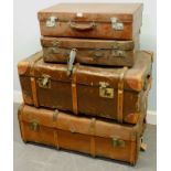 Four early 20thC and later leather suitcases, to include a brown dressing case.