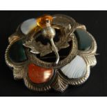 A Celtic brooch, set with agate and citrine, lacking one stone, 7.7g all in.