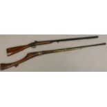 An Eastern rifle, with reeded metal barrel, brass mounts and hardwood stop, 154cm long, and a