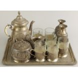 A Middle Eastern silver plated part coffee service, decorated with figures and animals, etc., and