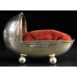 An unusual Edwardian silver pin cushion, modelled in the form of a crib, made by Adie and Lovekin