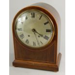 A late 19thC mahogany mantel clock, with an arched case, silvered dial, brass movement, 36cm high.