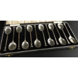 A set of twelve Edward VIII silver seal top spoons, in a fitted case, Birmingham 1936, 3½ozs