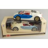 A Synergy Toys die-cast 1:10 scale model remote controlled car, 34cm wide, and another. (1 boxed)