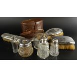 A collection of silver and white metal mounted dressing table items, to include brushes, jars and