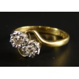 An 18ct gold diamond dress ring, set with two illusion set diamonds, 3.5g all in.