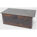 A 19thC oak Bible box, the rectangular top with a moulded edge above a carved and chequer banded