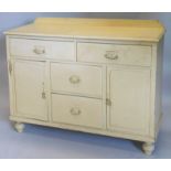 A cream painted dresser base, with a raised back above an arrangement of four drawers and two