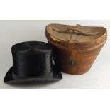 A brown leather hatbox and cover, containing a top hat by Lincoln, Bennett & Co of Piccadilly