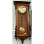 A walnut and ebonised Vienna type wall clock, with enamel type dial, 99cm high.