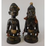 Tribal Art. A pair of Yoruba Ere-Ibeji twin dolls, male and female, each modelled with beaded