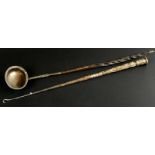 Two items of silver and white metal, a 19thC ladle with twisted whalebone handle, and a button