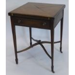 An Edwardian mahogany envelope card table, the square top above a frieze drawer on square tapering