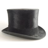 An early 20thC Imprimis top hat, internal measurements 17cm x 20cm