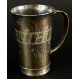 A George V silver christening mug, engraved with toys and the name Anthony, of tapering form,