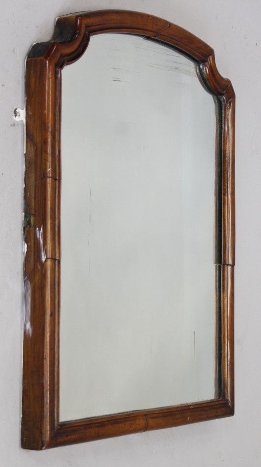 A Victorian walnut mirror, arched moulded frame, 73cm x 54cm.