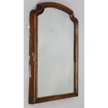 A Victorian walnut mirror, arched moulded frame, 73cm x 54cm.