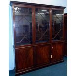 A 19thC mahogany library bookcase, the top with a dentil cornice, above three astragal glazed doors,